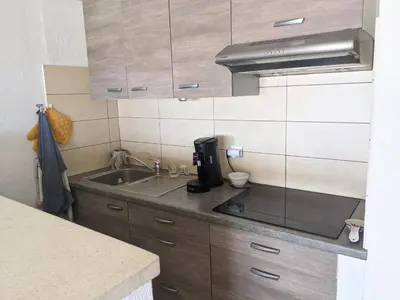 a kitchen with a sink and a counter top at T2 Climatisé 4 pers. avec Parking, Front de mer, Port-la-Nouvelle - FR-1-797-10 in Port-la-Nouvelle