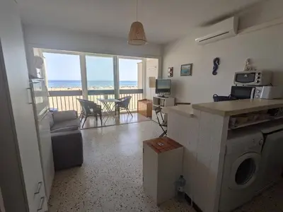 a living room with a view of the ocean at T2 Climatisé 4 pers. avec Parking, Front de mer, Port-la-Nouvelle - FR-1-797-10 in Port-la-Nouvelle