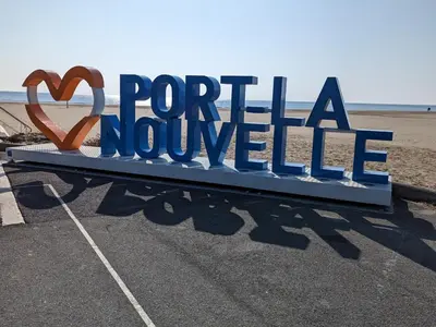 a sign that reads portilla novoille on the beach at Agréable T2 pour 5 pers, 1er étage, climatisé, parking sécurisé - FR-1-797-6 in Port-la-Nouvelle