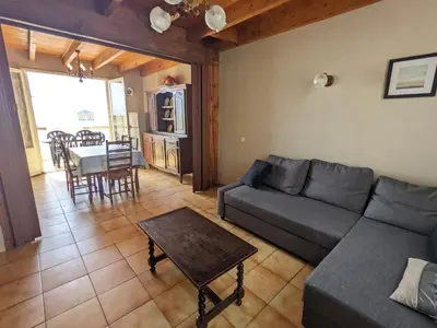 a living room with a couch and a table at T3 duplex 50m², 2 chambres, proche plage, 6 pers - FR-1-797-1 in Port-la-Nouvelle