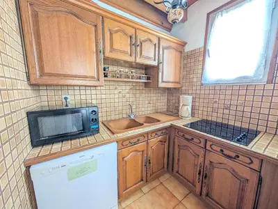 a boat sitting on the shore of a body of water at T3 duplex 50m², 2 chambres, proche plage, 6 pers - FR-1-797-1 in Port-la-Nouvelle