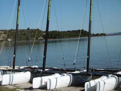 a group of sailboats sitting on the water at Charmant T3 rénové à 60m de la plage avec terrasse, jardin et parking clos - FR-1-797-28 in Port-la-Nouvelle