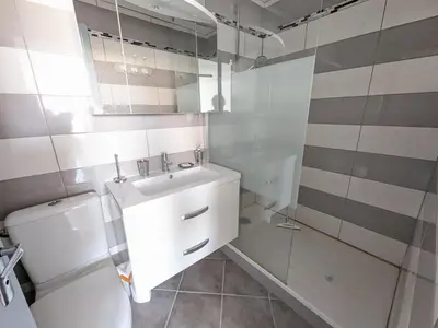 a bathroom with a toilet and a sink and a shower at Grand T2 Climatisé 36m² avec Parking à 450m de la Plage - 4 Pers - FR-1-797-34 in Port-la-Nouvelle