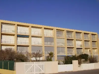 an apartment building with balconies on the side of it at Port-la-Nouvelle : Studio front de mer, 4 pers, parking inclus - FR-1-797-32 in Port-la-Nouvelle