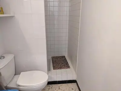a bathroom with a toilet and a shower stall at Port-la-Nouvelle : Studio front de mer, 4 pers, parking inclus - FR-1-797-32 in Port-la-Nouvelle