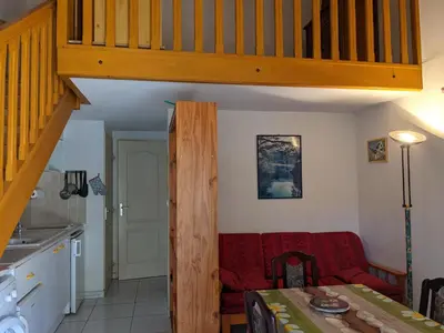a kitchen and a living room with a staircase at Belle Villa T3 Mezzanine, à 450m Plage, 5 Pers, Terrasse, Jardin, Garage & Parking - FR-1-797-33 in Port-la-Nouvelle
