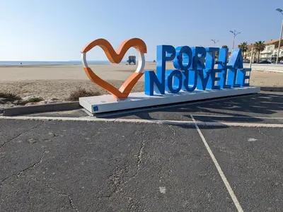 a boat sitting on the shore of a body of water at Villa T3 climatisée, 57m², 5/6 pers, proche plage, rénovée, terrasse, parking, quartier animé - FR-1-797-48 in Port-la-Nouvelle