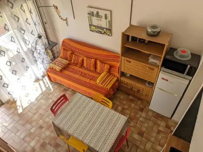 an overhead view of a living room with a couch at Villa T3 Mezzanine Climatisée, Proche Plage, Parking et Terrasse - 6 Pers - FR-1-797-56 in Port-la-Nouvelle