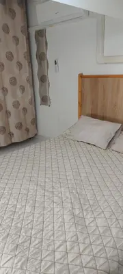an empty bed in a room with a bed frame at maison pour vacance a la mer in Port-la-Nouvelle