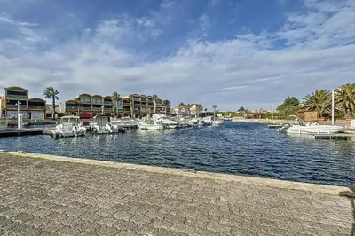a group of boats are docked in a harbor at Studio with pool near the harbor in Gruissan