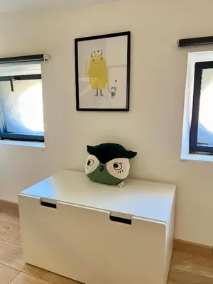 a white drawer with a cat toy on top of it at La circulade - Maison de caractère avec jardin in Bram