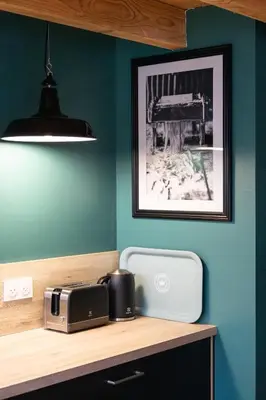 a kitchen with a counter with a toaster and a printer at L'atelier de 1900 in Puicheric