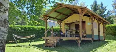 a gazebo with a hammock in a yard at Lodge Safari tent in Camurac
