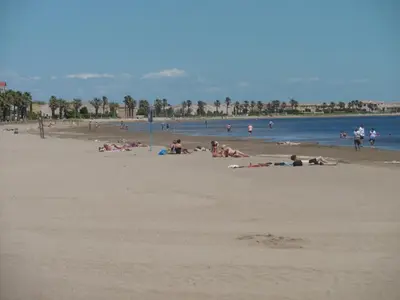 a group of people laying on the beach at Appartement T2 à Gruissan, RDC, Plage à 150m, Parking, 4-5 pers - FR-1-796-72 in Gruissan
