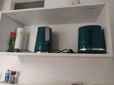 a shelf with two appliances sitting on it at Appartement T2 à Gruissan, RDC, Plage à 150m, Parking, 4-5 pers - FR-1-796-72 in Gruissan