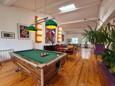 a room with a pool table in a room at Loft au piémont des Pyrénées Cathares in Sainte-Colombe-sur-lʼHers