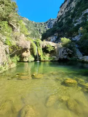 a pool of water in a river in a canyon at Cyprès de vos rêves in Ornaisons