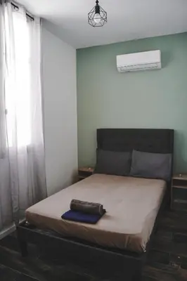 a bedroom with a bed with a pillow on it at AV de Bordeaux in Narbonne
