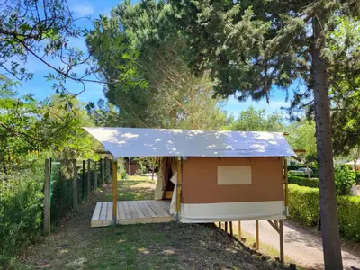 a yurt is set up under a tent at Camping Le Val de Cesse in Mirepeisset