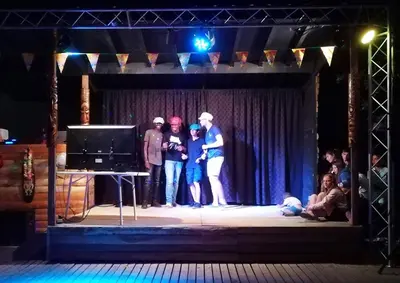 a group of people standing on a stage at Camping Le Val de Cesse in Mirepeisset