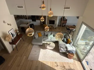 an overhead view of a living room with a couch at Maison paisible toute équipée, piscine chauffée in Sallèles-dʼAude