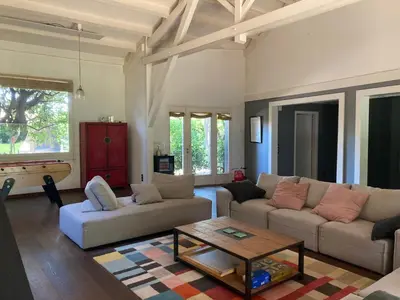 a living room with a couch and a coffee table at Maison exceptionnelle piscine in Aussillon