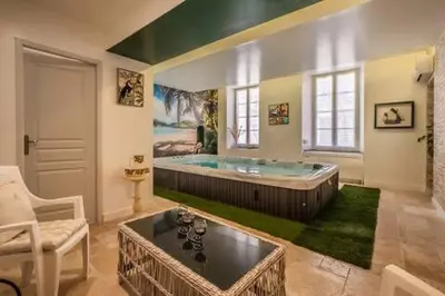 a large bathroom with a large tub in a room at Le clos des jacobins in Narbonne