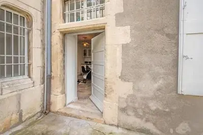 an entrance to a building with a white door at Le clos des jacobins in Narbonne