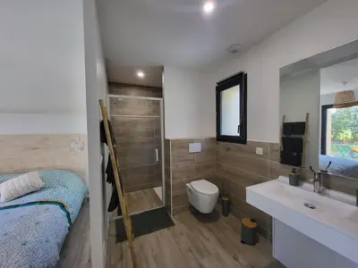 a bathroom with a sink and a toilet and a shower at Chambre Le Ka-Marrant in Les Pujols
