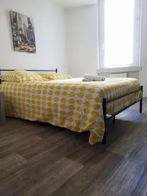a bed with a polka dot blanket on it at Cosy Hypercentre Netflix in Narbonne