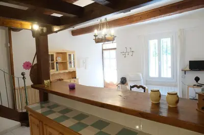 a kitchen with a large counter with vases on it at Charmante Maison de Village dans les fenouilledes in Cassagnes