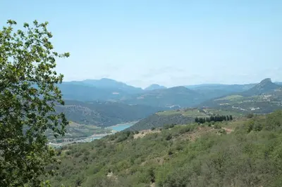 a view of a valley with a river and mountains at Charmante Maison de Village dans les fenouilledes in Cassagnes
