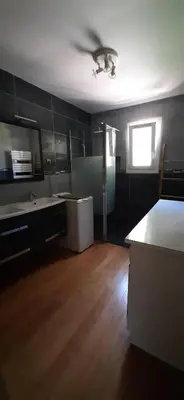 a room with a kitchen with a sink and a table at Villa Bellevue in Roquefort-des-Corbières