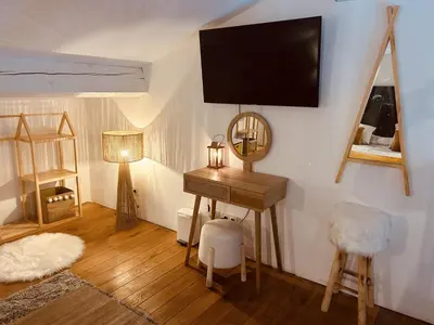 a room with a desk and a television on a wall at LE PAOLO Appartement Deluxe in Narbonne