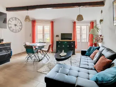 a living room with a couch and a table at Vue imprenable cité Carcassonne - 4 personnes in Carcassonne
