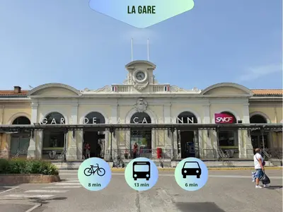 a large building with four signs in front of it at Vue imprenable cité Carcassonne - 4 personnes in Carcassonne
