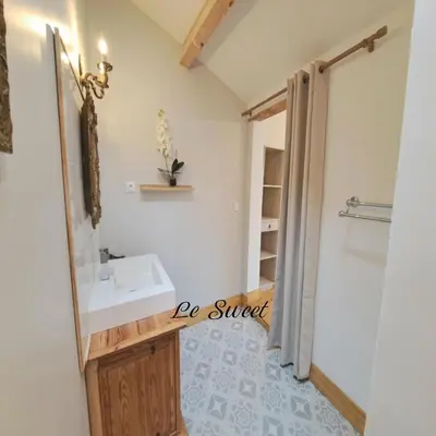 a bathroom with a sink and a mirror at La Maison du Canal - Homps - Le Sweet in Homps