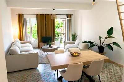 a living room with a couch and a table at Casa Tramuntana in Tautavel