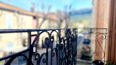 a iron railing on a balcony with a building at Casa Tramuntana in Tautavel