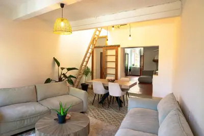 a living room with a couch and a table at Casa Tramuntana in Tautavel