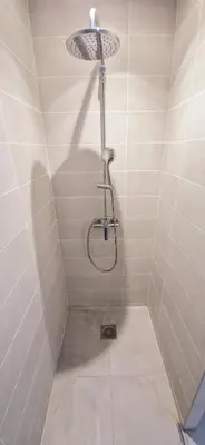 a shower with a shower head in a bathroom at Maison à louer in Narbonne
