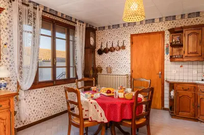 a bedroom with a bed with a teddy bear on it at L'Oustal 3 chambres avec grand jardin parking gratuit in Bram