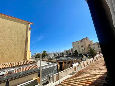 a view from a balcony of a building with stairs at Duplex T4 Confort 6 Pers., Piscine, Parking, Centre Port à Gruissan - FR-1-796-74 in Gruissan