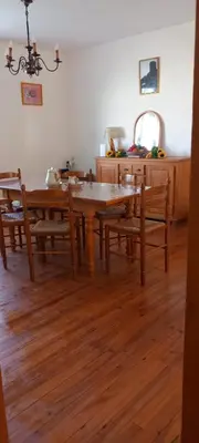 a dining room with a wooden table and chairs at Terrasse avec vue-Spa-Clim sur les 2 niveaux-Famille-Vacances-Week-end in Preixan