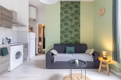 a living room with a couch and a table at Le 107 CARCA ! in Carcassonne