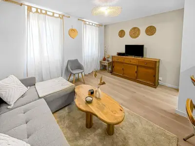 a living room with a couch and a coffee table at 490 appartement in Carcassonne