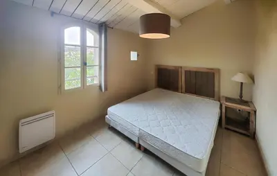 a bedroom with a bed and a window at Lovely Home In Saint Laurent De La Ca in Saint-Laurent-de-la-Cabrerisse