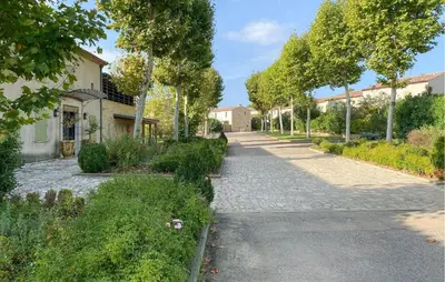 a cobblestone street in front of a house at Lovely Home In Saint Laurent De La Ca in Saint-Laurent-de-la-Cabrerisse