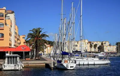 a group of boats docked in a harbor with buildings at Lovely Home In Saint Laurent De La Ca in Saint-Laurent-de-la-Cabrerisse