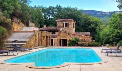 a swimming pool in front of a stone house at Magnifique Mas avec Piscine - La Bergerie du Razès in Alet-les-Bains